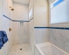 Spacious Walk in Shower with built in Shampoo Shelf.
