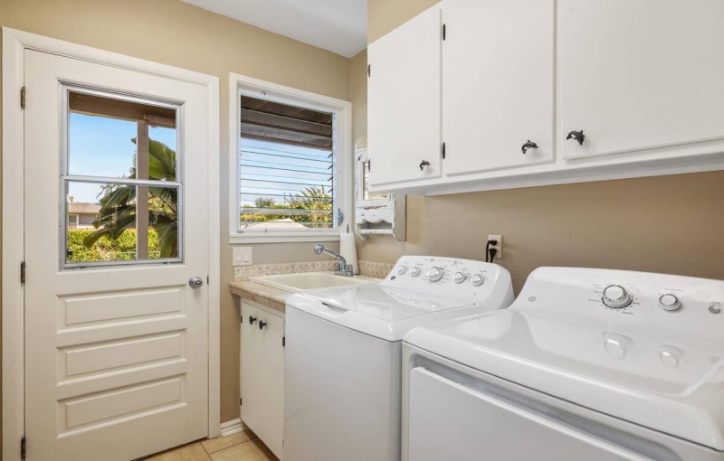 Laundry room on the first floor. Door leads out to the backyard and spa.